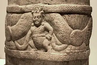 Scroll supported by Indian Yaksha, Amaravati Stupa, 2ndโ3rd century CE.
